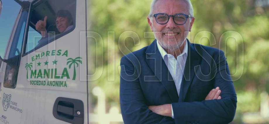 El intendente de Tigre Julio Zamora junto a un camión ploteado con el logo de Empresa Manila S.A. y la insignia de Tigre Municipio.
